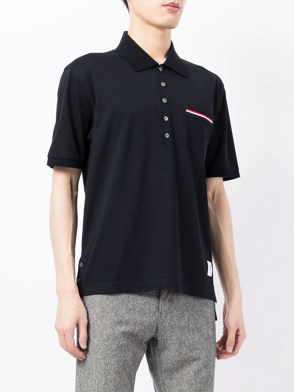 Thom Browne Fine Mercerized Pocket Polo in dark charcoal grey with signature RWB stripe chest pocket and 4-button placket