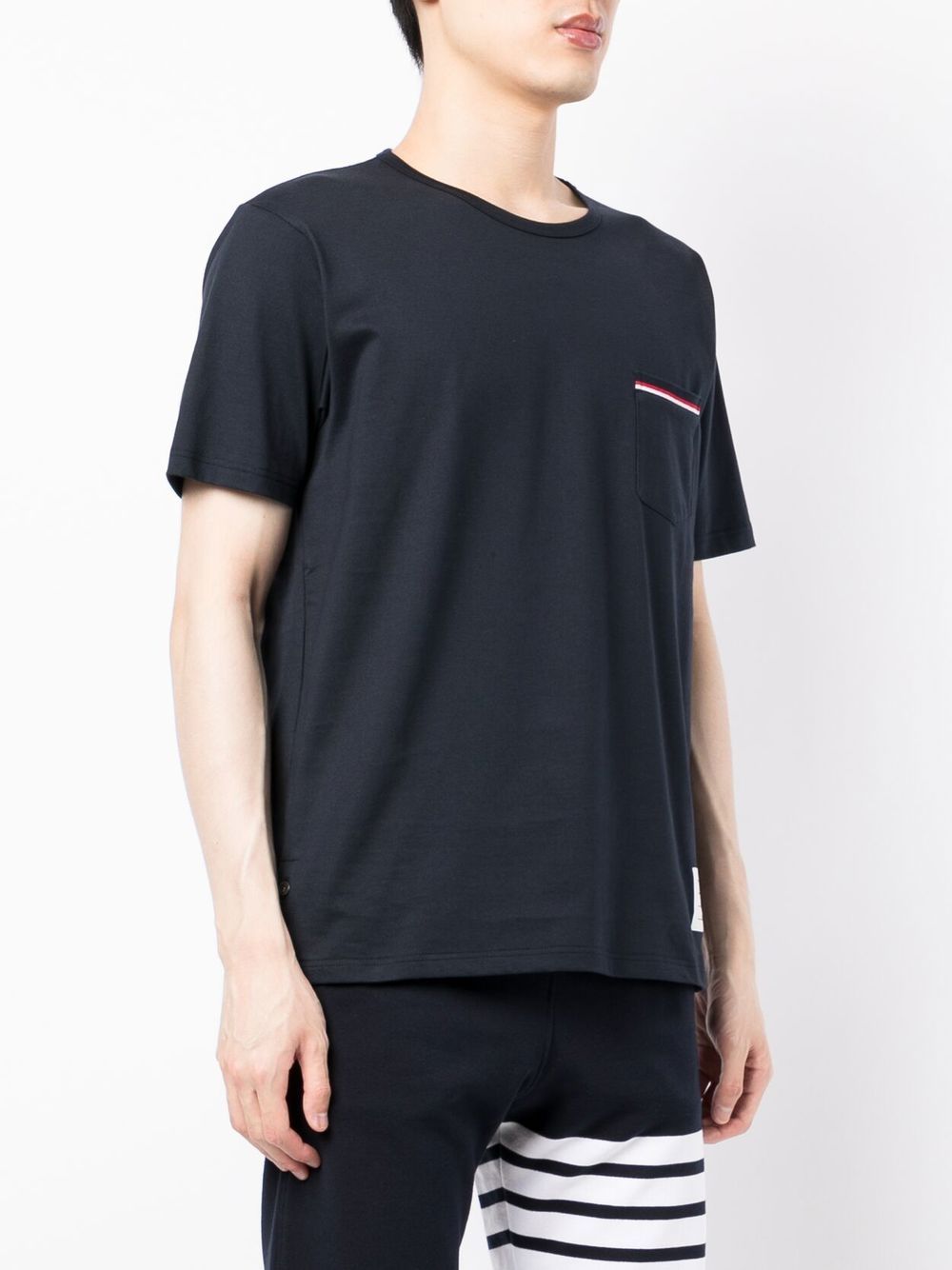 Thom Browne navy jersey pocket T-shirt with tricolor stripe chest pocket trim and logo patch at hem, made in Italy