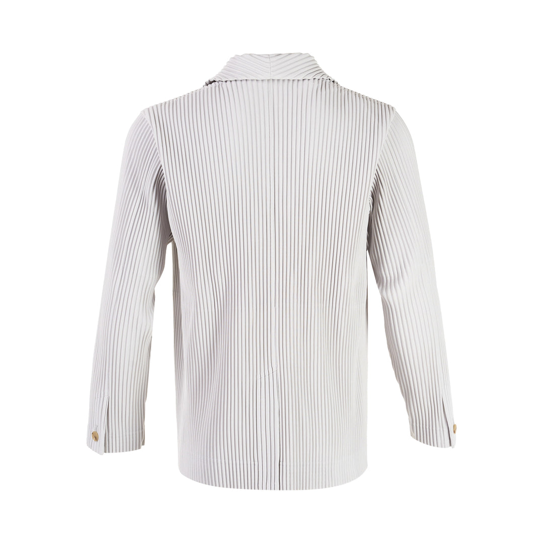Homme Plissé Issey Miyake two-button pleated blazer in light grey with notch lapels and gold-tone buttons, flat lay on white background