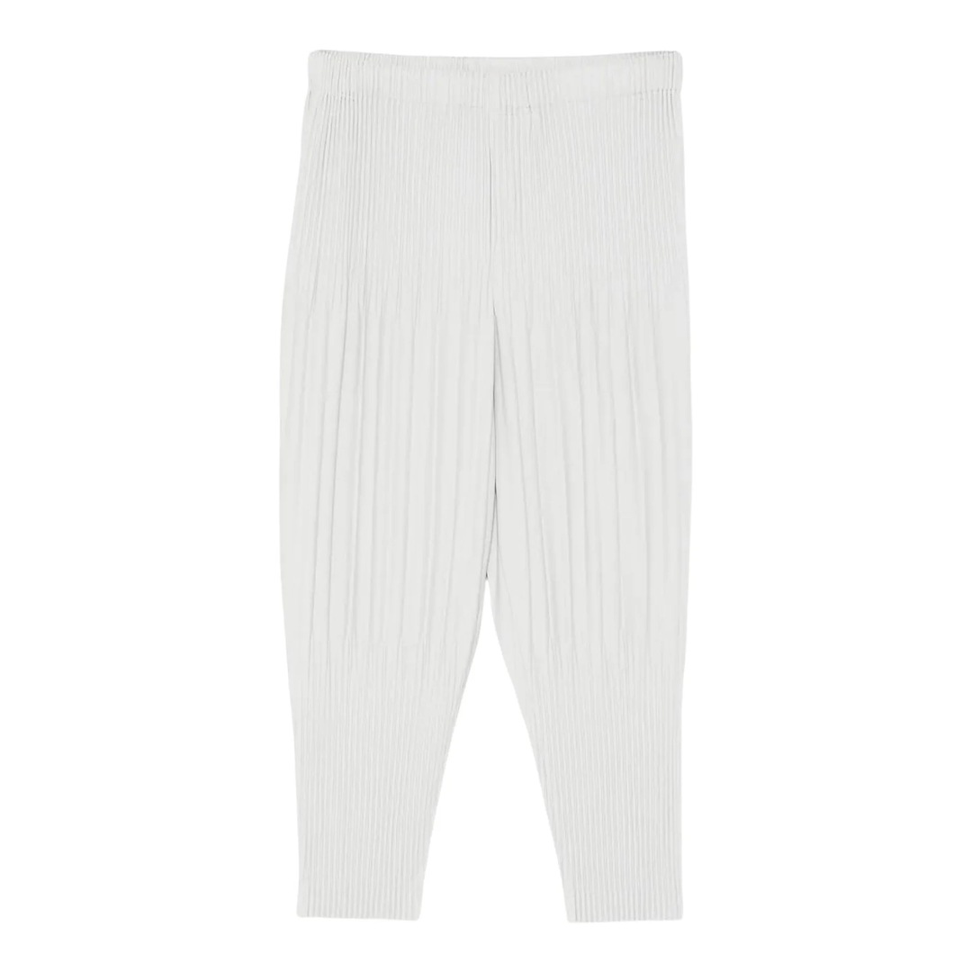 Homme Plissé Issey Miyake Fluffy Long Wide Pants in off-white with signature vertical pleating and elastic waistband, flat lay view