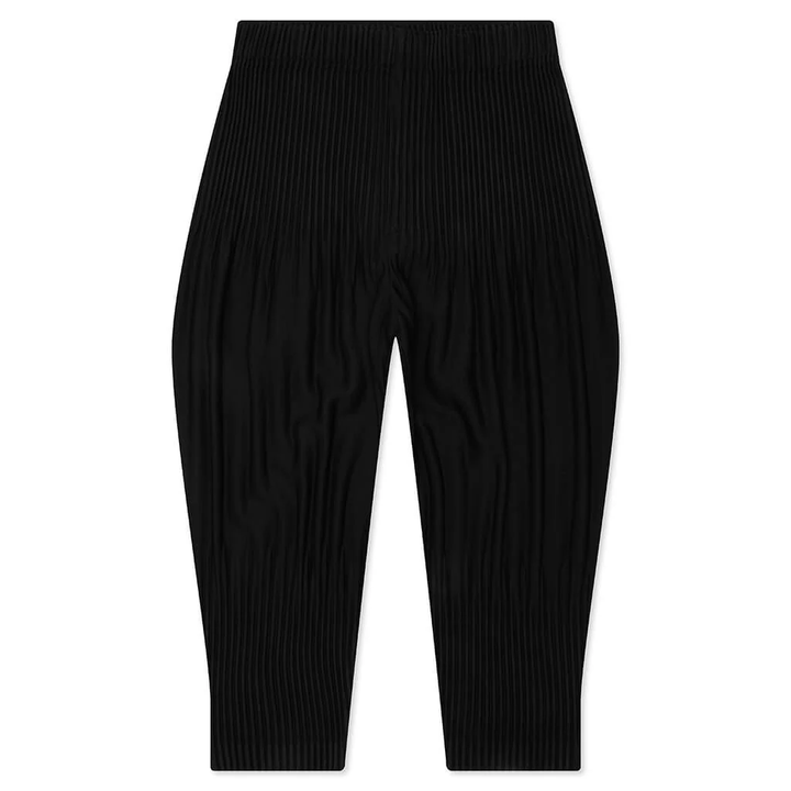 Homme Plissé Issey Miyake Long Wider Pants in black with signature pleated fabric and relaxed wide-leg silhouette, flat lay view