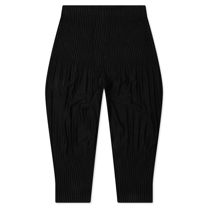Homme Plissé Issey Miyake Long Wider Pants in black with signature pleated fabric and relaxed wide-leg silhouette, flat lay view