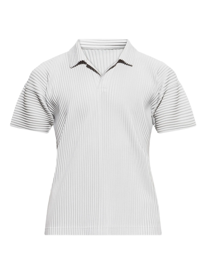 Homme Plissé Issey Miyake black pleated short sleeve polo with open revere collar and all-over vertical pleating, laid flat on white background