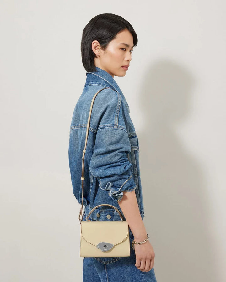 حقيبة صغيرة لانا ذات مقبض علوي بلون الزبدة الناعمة