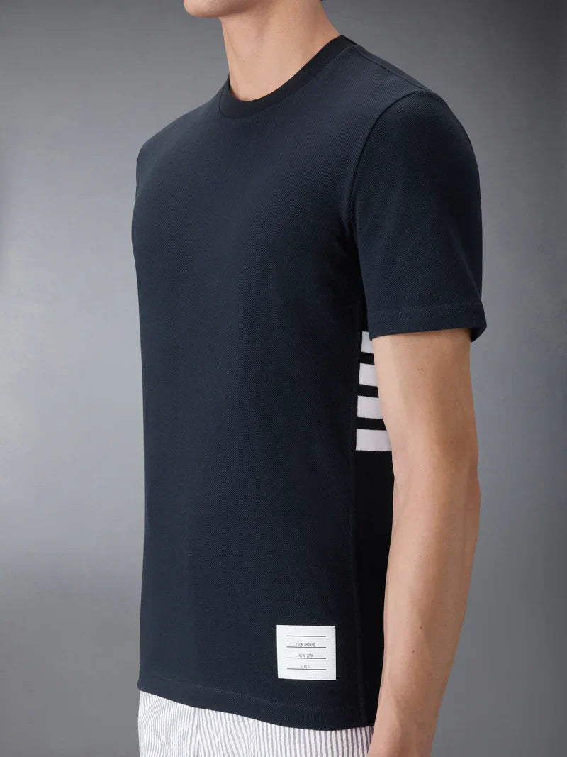 Thom Browne Classic Piqué 4-Bar Tee in light blue with signature stripe collar and woven hem label, front view