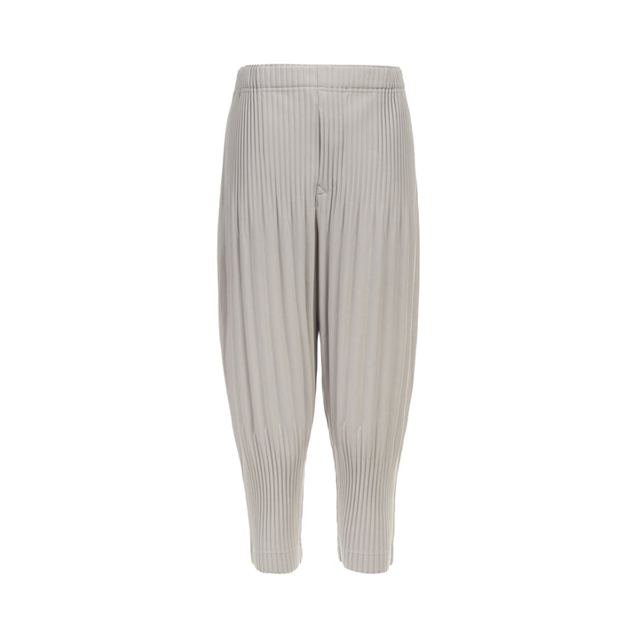 Homme Plissé Issey Miyake Basic Fluffy Long Pants in light grey, featuring signature all-over pleating, a relaxed balloon-tapered silhouette, elasticated waistband, and ribbed ankle cuffs
