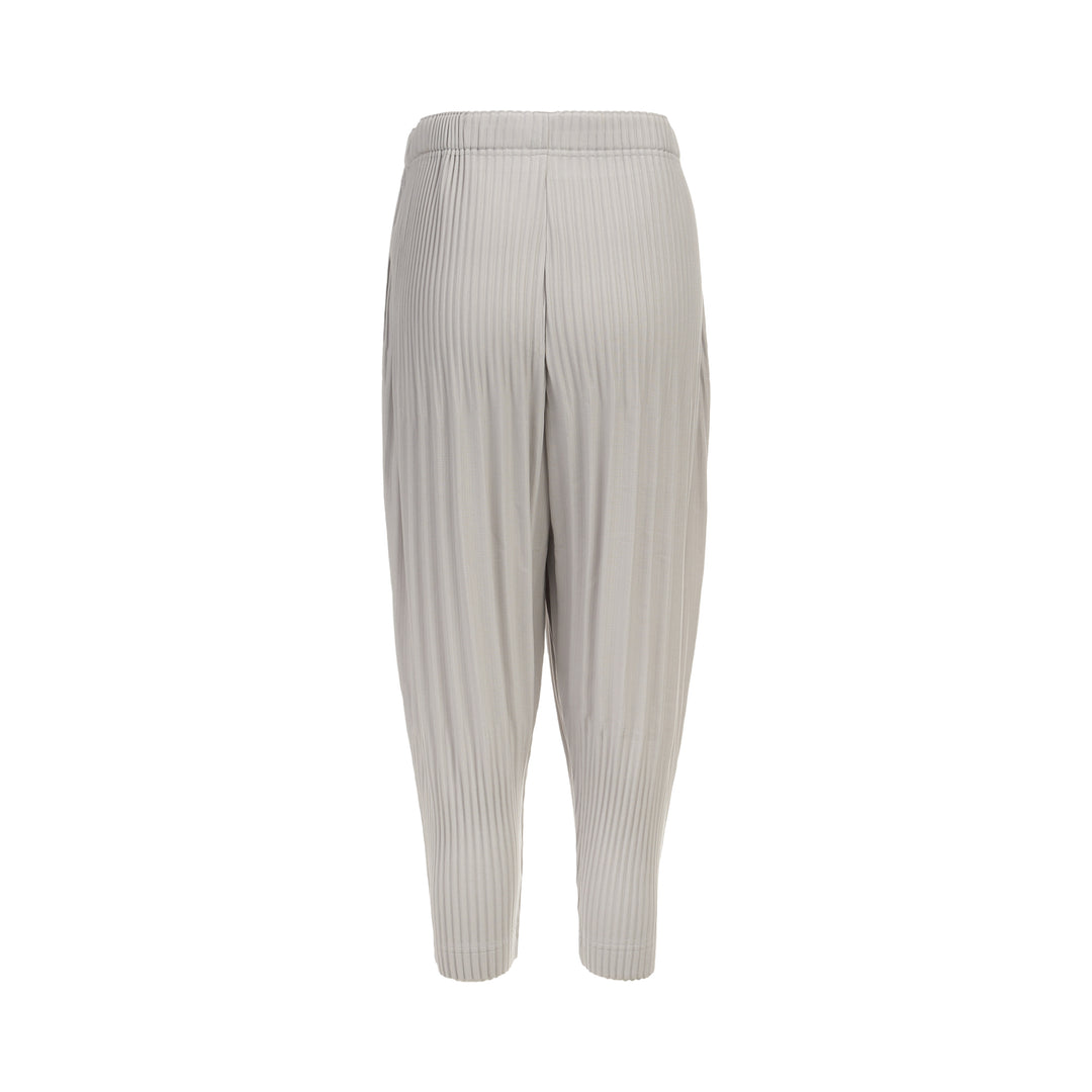 Homme Plissé Issey Miyake Basic Fluffy Long Pants in light grey, featuring signature all-over pleating, a relaxed balloon-tapered silhouette, elasticated waistband, and ribbed ankle cuffs - view 2
