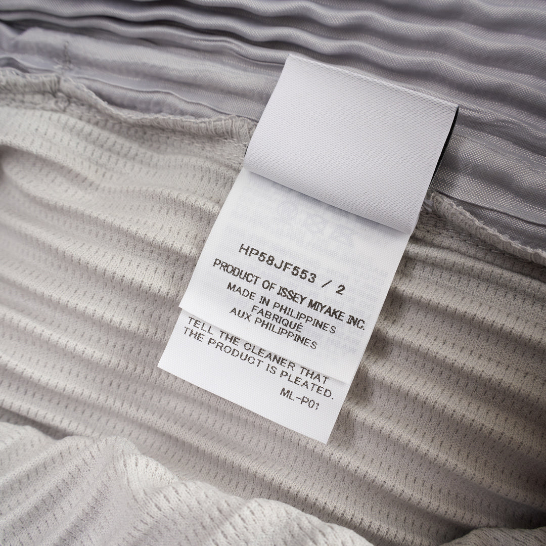 Homme Plissé Issey Miyake Basic Fluffy Long Pants in light grey, featuring signature all-over pleating, a relaxed balloon-tapered silhouette, elasticated waistband, and ribbed ankle cuffs - view 3