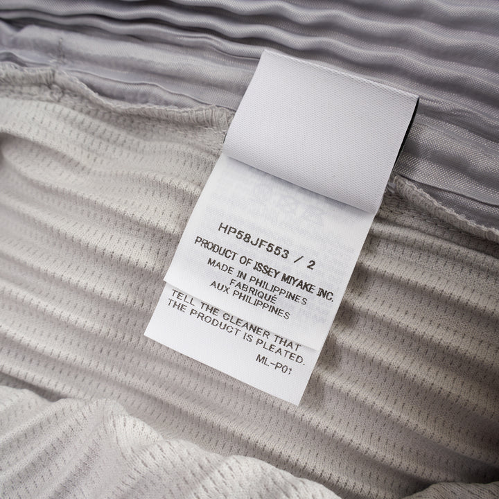 Homme Plissé Issey Miyake Basic Fluffy Long Pants in light grey, featuring signature all-over pleating, a relaxed balloon-tapered silhouette, elasticated waistband, and ribbed ankle cuffs - view 3
