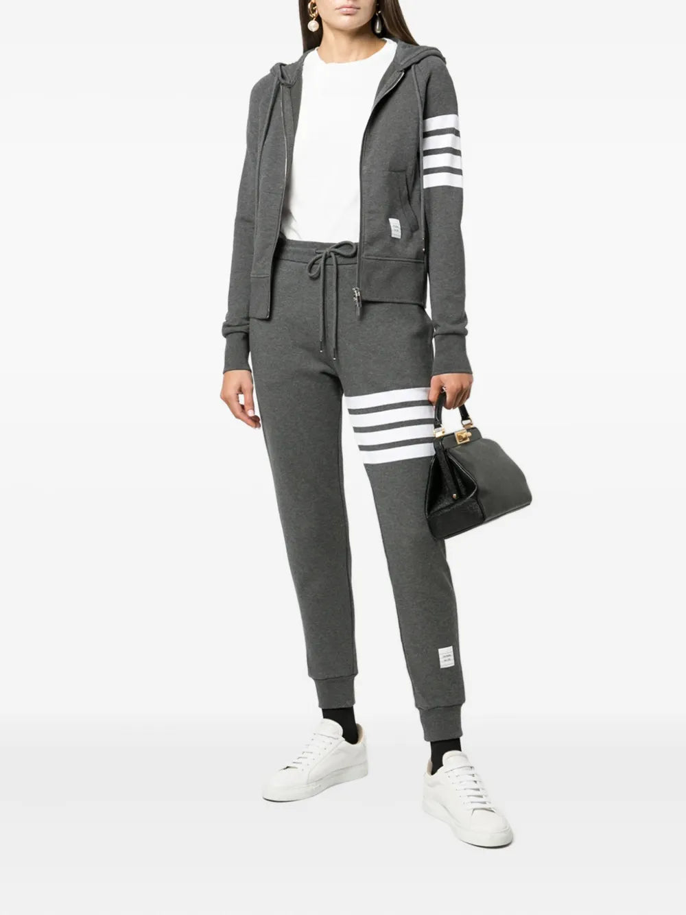 Thom Browne grey marl zip-up hoodie with four-bar white and grey stripe detail on the upper sleeve, full silver zip, drawstring hood, and front kangaroo pockets