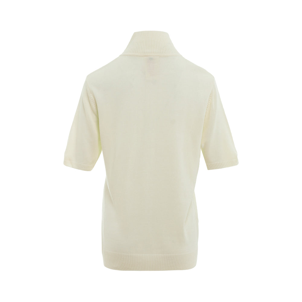 Rally Movement cream short sleeve quarter-zip knit polo with ribbed mock neck collar and embroidered RM monogram logo