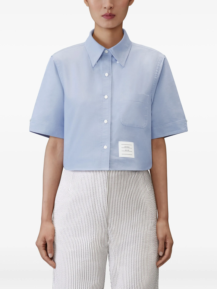 Thom Browne light blue cropped point collar short sleeve Oxford shirt with chest pocket and signature brand label