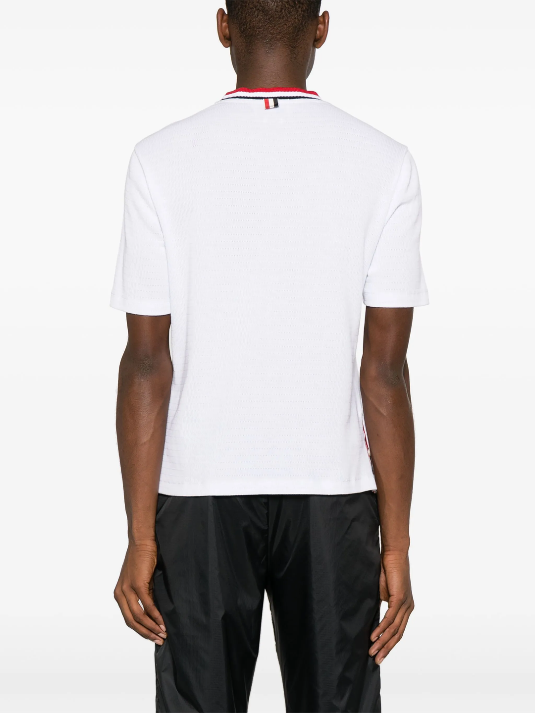 Thom Browne white short sleeve racking stitch crewneck tee with red, white, and navy stripe collar and chest pocket trim