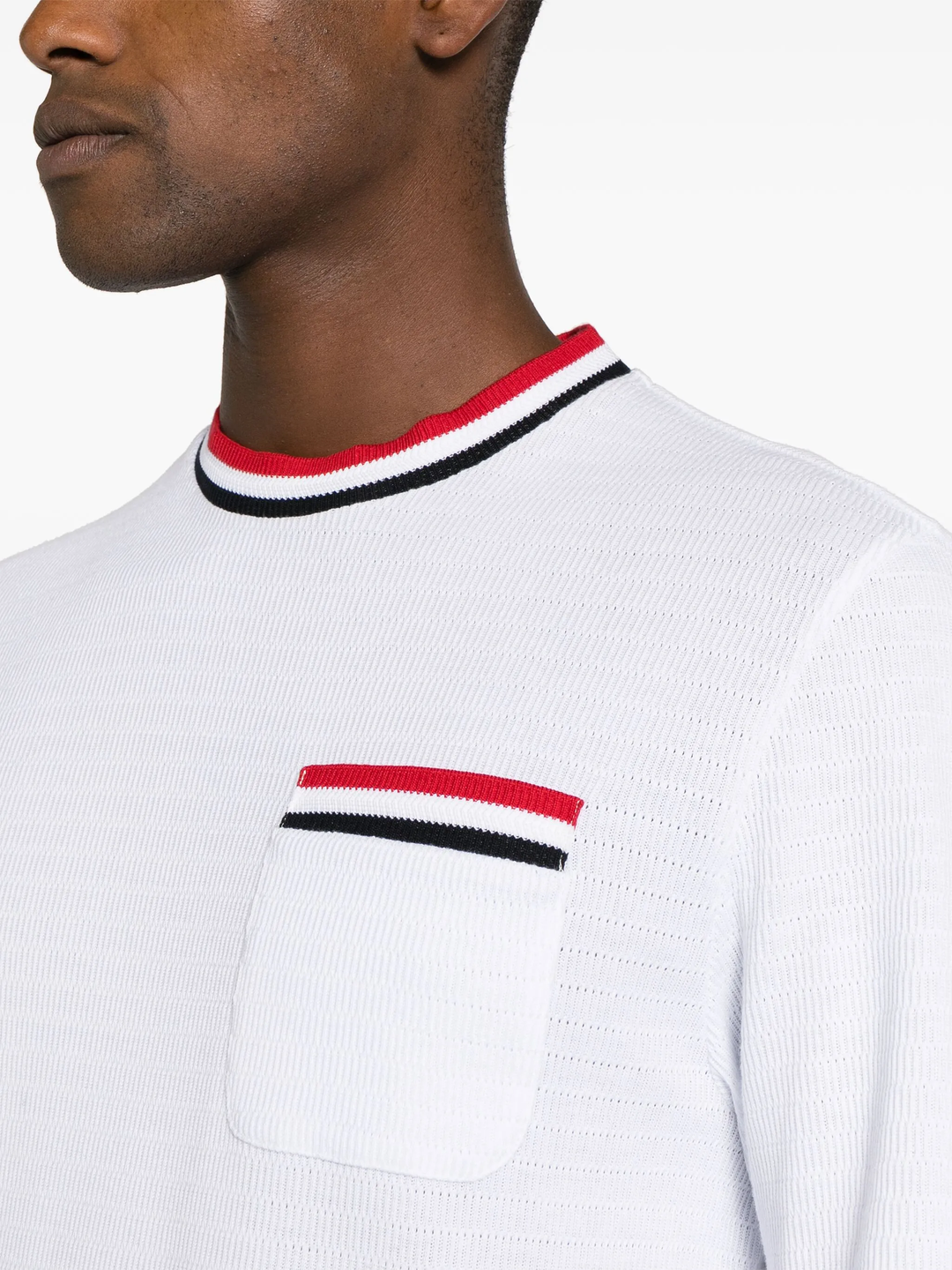 Thom Browne white short sleeve racking stitch crewneck tee with red, white, and navy stripe collar and chest pocket trim