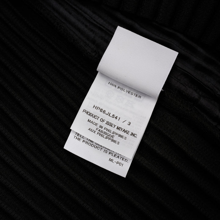 Homme Plissé Issey Miyake Basic Button Cardigan in black, featuring signature permanent accordion pleating across the body and long sleeves, with a deep V-neckline and four snap-button front closure - view 3