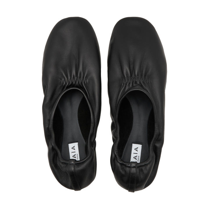 ALAÏA Black Leather Slippers – Available at Club 21, Official Retailer in Singapore, Malaysia & Thailand with Global Shipping Online