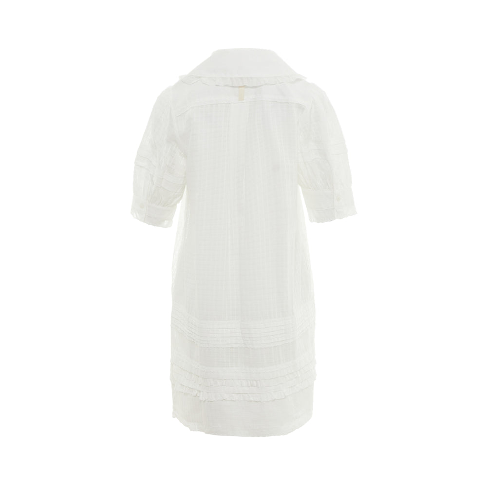 Lee Mathews Victoria Mini Dress in white with Peter Pan collar, ruffled bib yoke, pintuck detailing, short puff sleeves, and scalloped hem trim