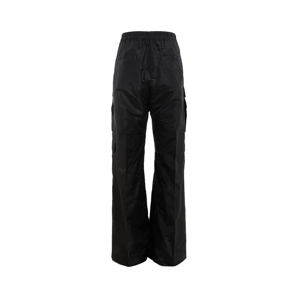 Rick Owens Cargo Belas Pants in black — oversized wide-leg fit with elasticated drawstring waist, multiple flap cargo pockets, and snap-button hardware on a white background
