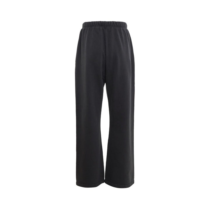 Fear of God Essentials Signature Flare Sweatpant in washed black with elastic drawstring waistband and wide flare leg