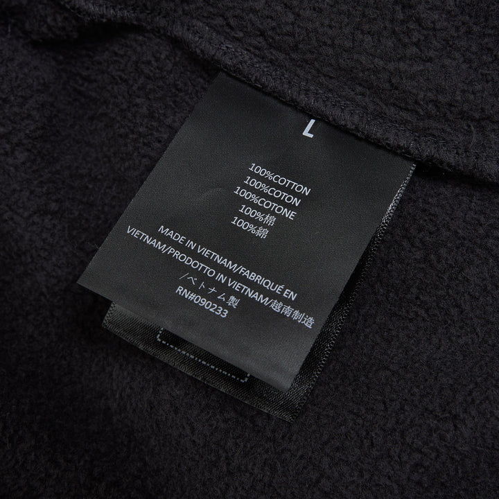 Fear of God Essentials Signature Flare Sweatpant in washed black with elastic drawstring waistband and wide flare leg