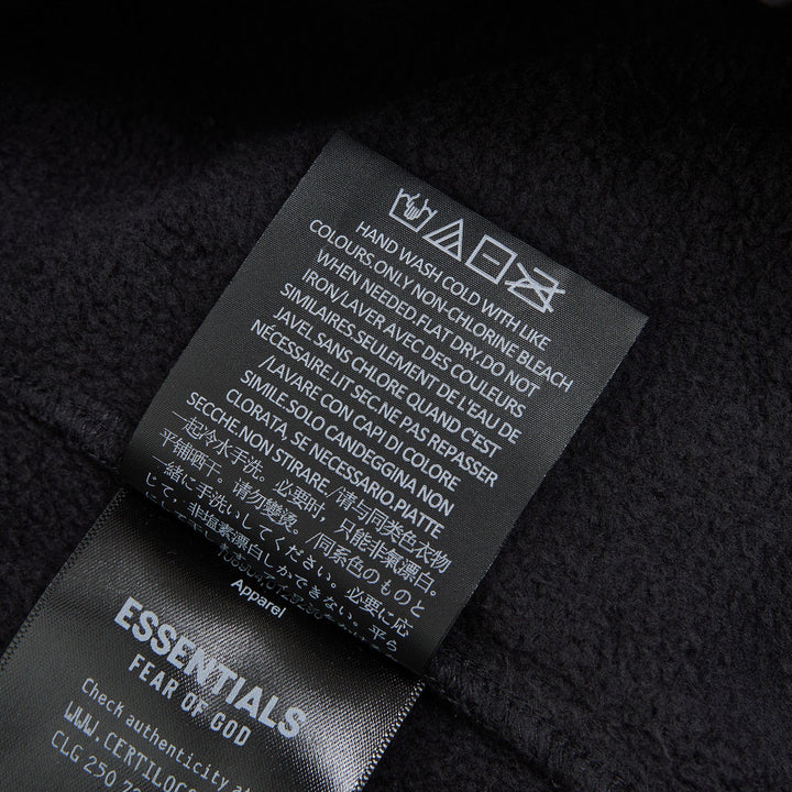 Fear of God Essentials Signature Flare Sweatpant in washed black with elastic drawstring waistband and wide flare leg