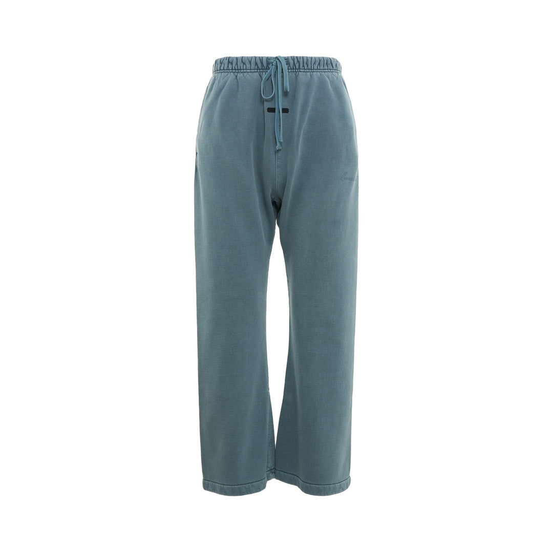 Fear of God Essentials Signature Flare Sweatpant in washed teal with elasticated drawstring waistband and wide-leg silhouette