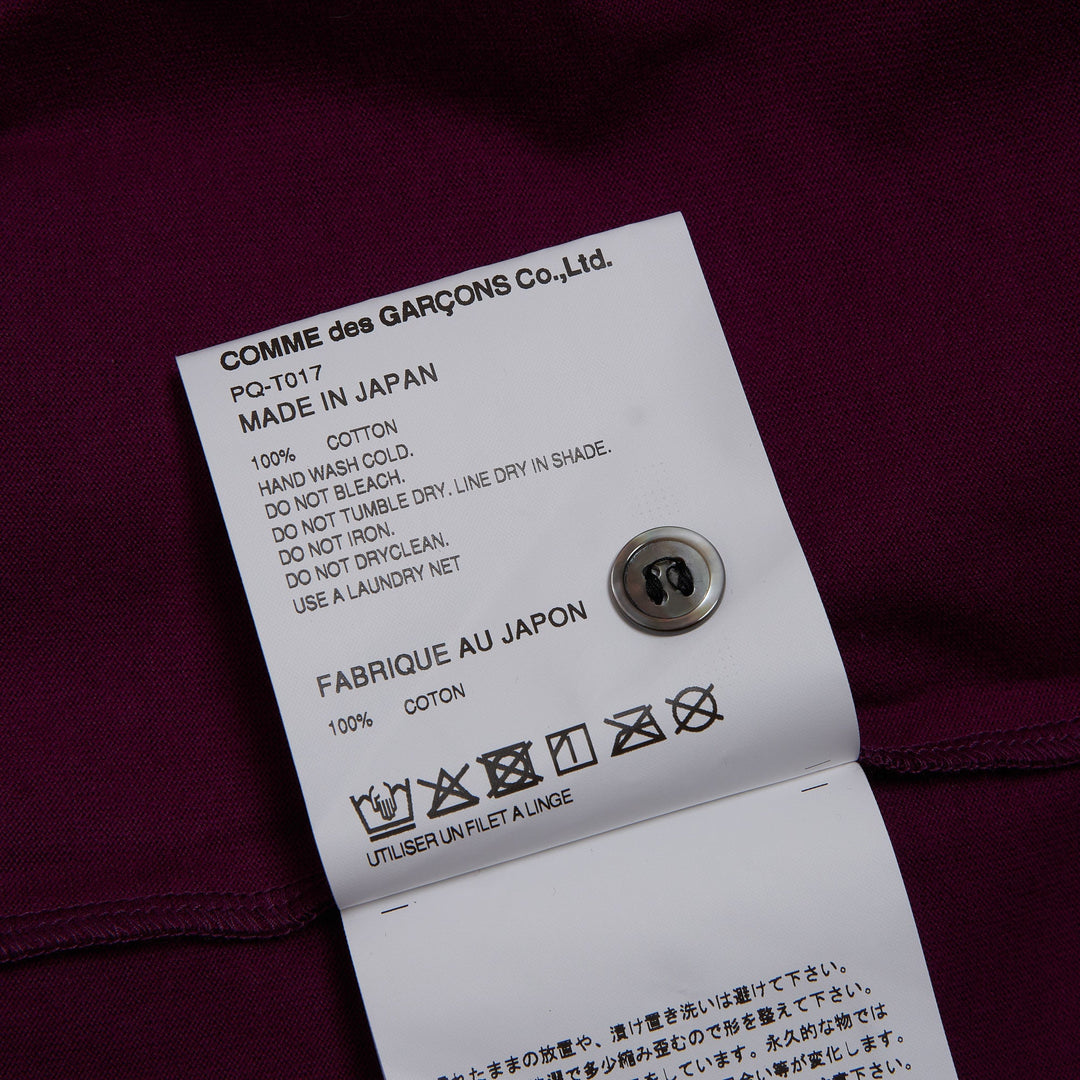 COMME des GARÇONS HOMME PLUS Floral Print Polo Shirt in deep magenta and black all-over geometric floral pattern