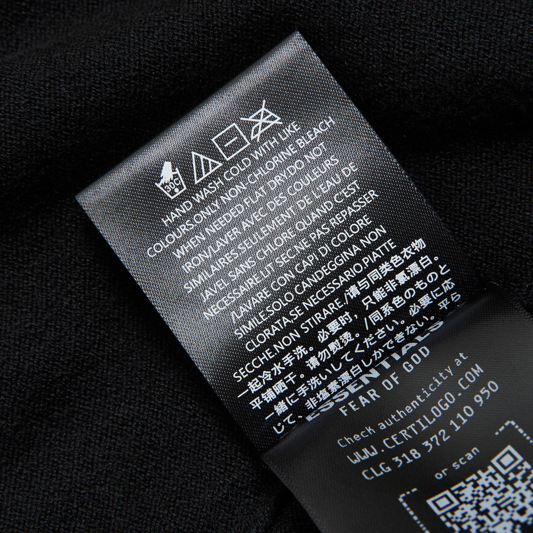 Fear of God ESSENTIALS Women's Boxy Knit Tee in black with wide flutter sleeves and ribbed crew neckline