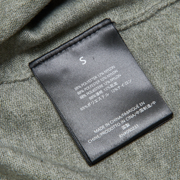 Fear of God ESSENTIALS Women's Boxy Knit Tee in heather grey with wide short sleeves and ribbed mock neckline, flat lay on white background