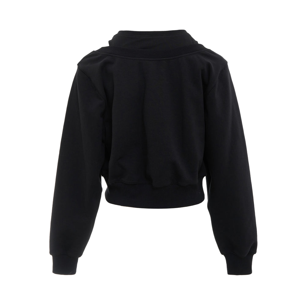 3.1 Phillip Lim black cropped long sleeve sweatshirt with cut-out shoulder, silver ring hardware embellishment, and double-layer pleated front panel