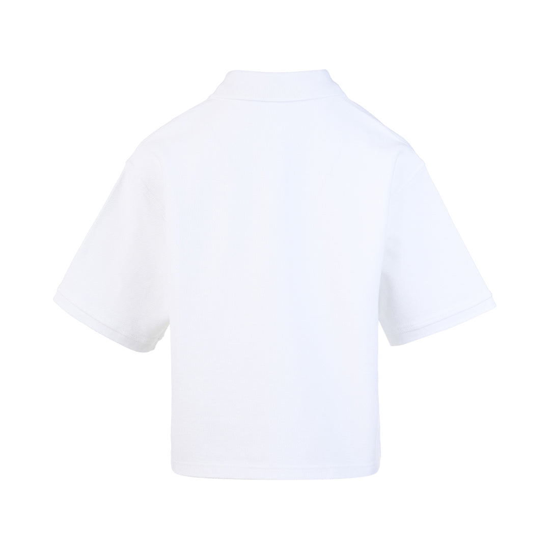 Alexander Wang oversized cropped piqué polo top in washed blue with a spread collar, two-button placket, dropped shoulders, and tonal logo embroidery on the chest
