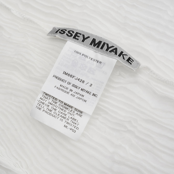 Issey Miyake Chiffon Twist Short Sleeve Shirt in white, featuring a ribbed knit texture, mock neck collar, and fitted silhouette, shown from the back