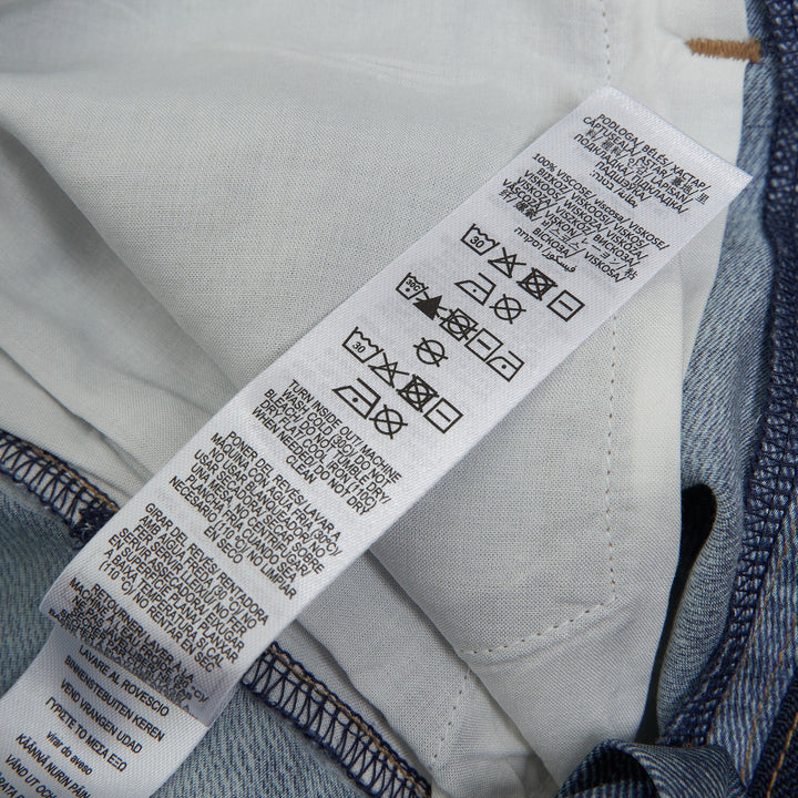 rag & bone Miramar Carpenter Wide-Leg Jeans in faded mid-blue denim with front patch pockets and high-rise waist