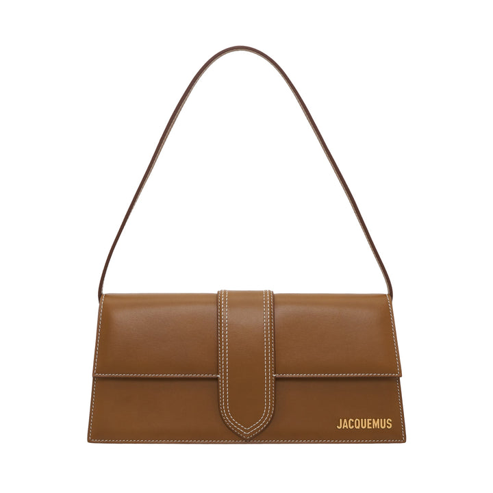 JACQUEMUS Le Bambino Long shoulder bag in tan smooth leather with white contrast stitching, central tab closure, and gold logo lettering