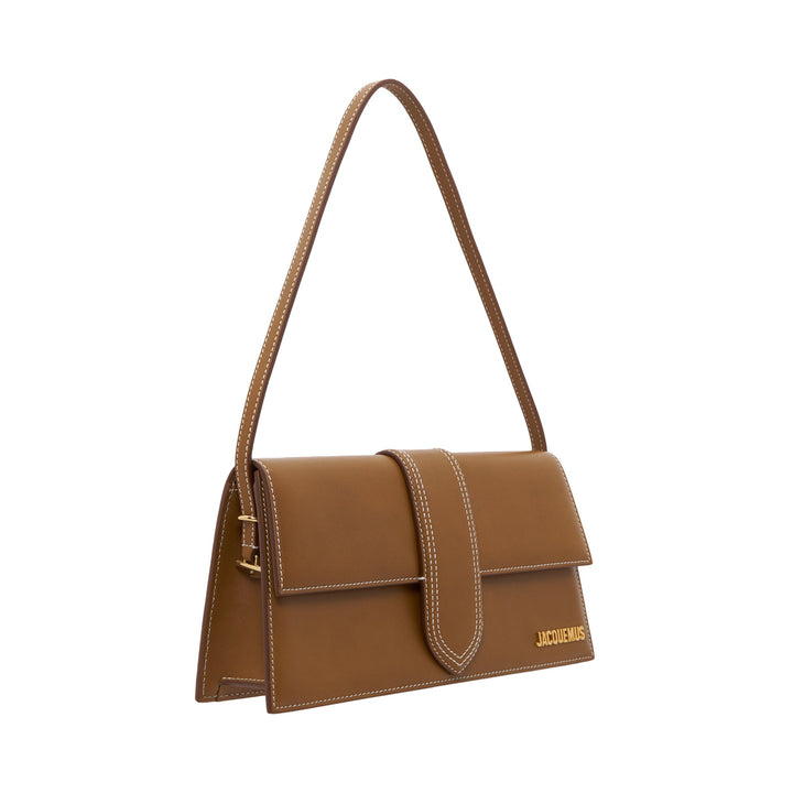 JACQUEMUS Le Bambino Long shoulder bag in tan smooth leather with white contrast stitching, central tab closure, and gold logo lettering