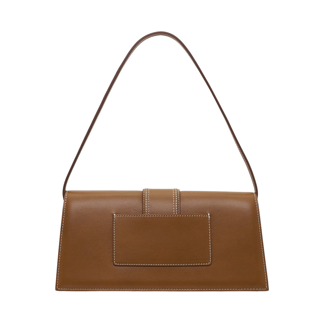 JACQUEMUS Le Bambino Long shoulder bag in tan smooth leather with white contrast stitching, central tab closure, and gold logo lettering