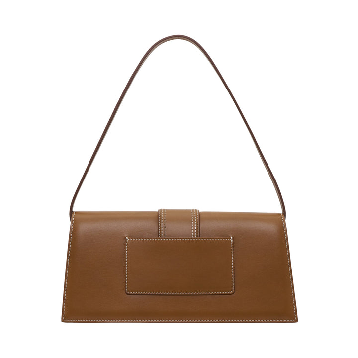 JACQUEMUS Le Bambino Long shoulder bag in tan smooth leather with white contrast stitching, central tab closure, and gold logo lettering