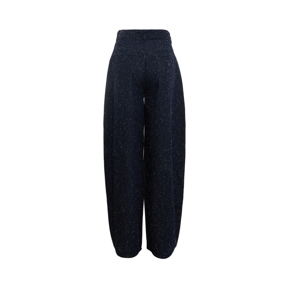 Jacquemus Ovalo Wide-Leg Jeans in dark navy speckled denim with a high-rise waist and voluminous barrel-shaped leg