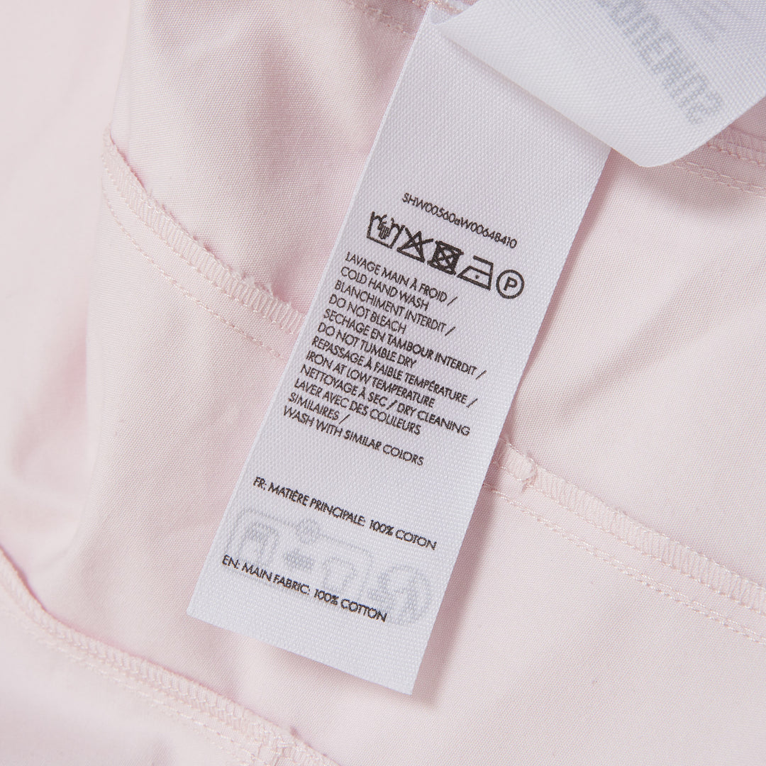 Jacquemus La Chemise Moisson Blouse in light blush pink with wide structured sleeves and fitted waist, back view