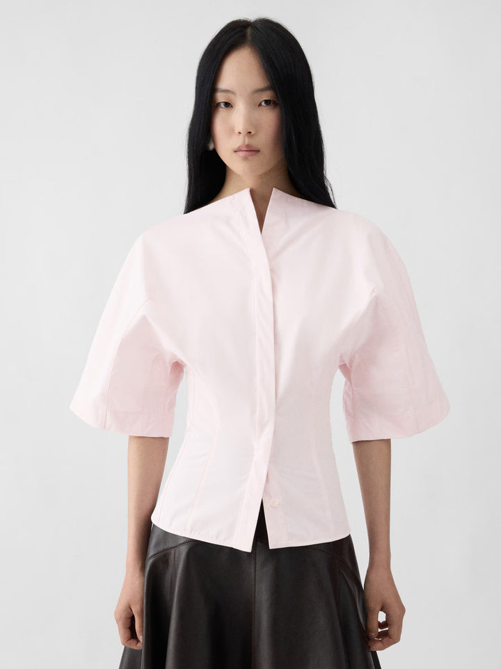Jacquemus La Chemise Moisson Blouse in light blush pink with wide structured sleeves and fitted waist, back view
