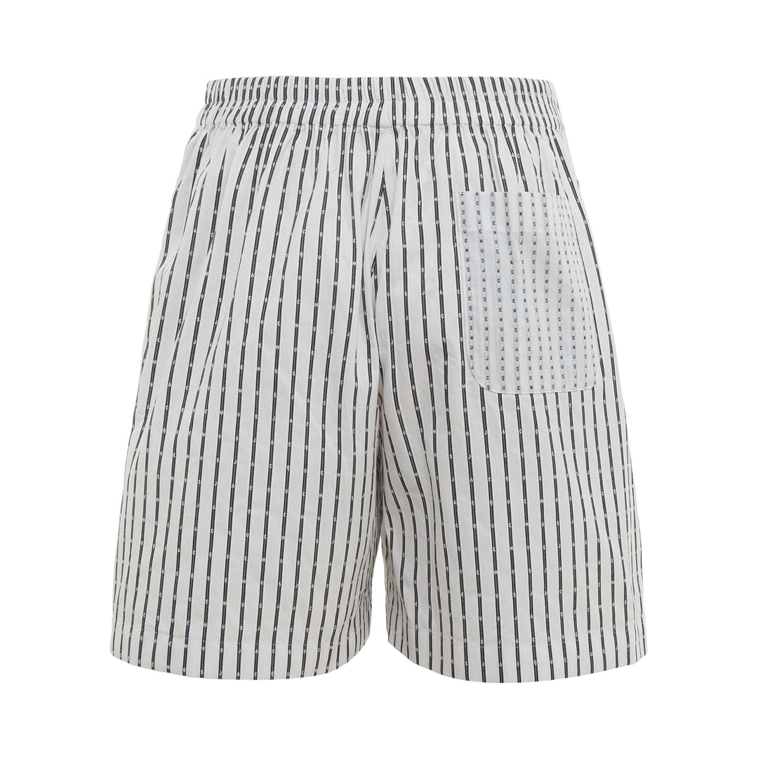 Jacquemus white striped Bermuda shorts with vertical navy logo-print stripes and button waist closure