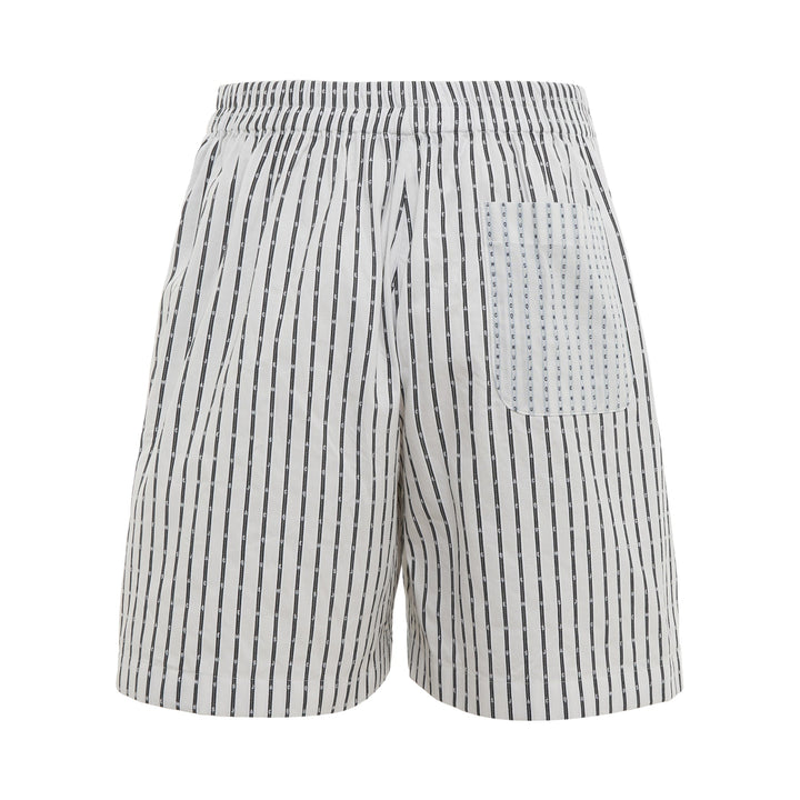 Jacquemus white striped Bermuda shorts with vertical navy logo-print stripes and button waist closure