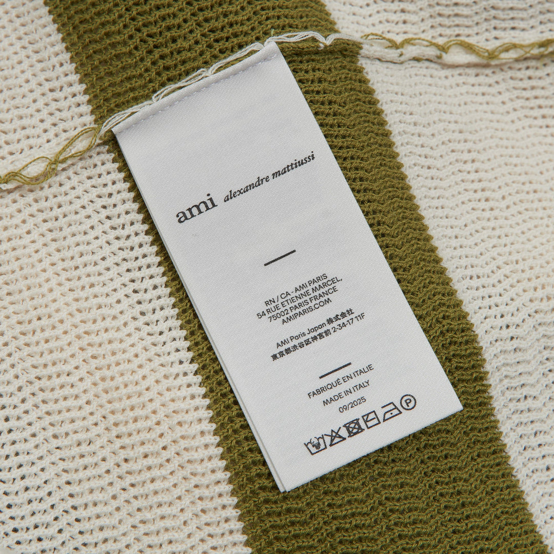 AMI Striped Knit Polo Dress in olive green and cream horizontal stripes with signature heart logo patch and polo collar