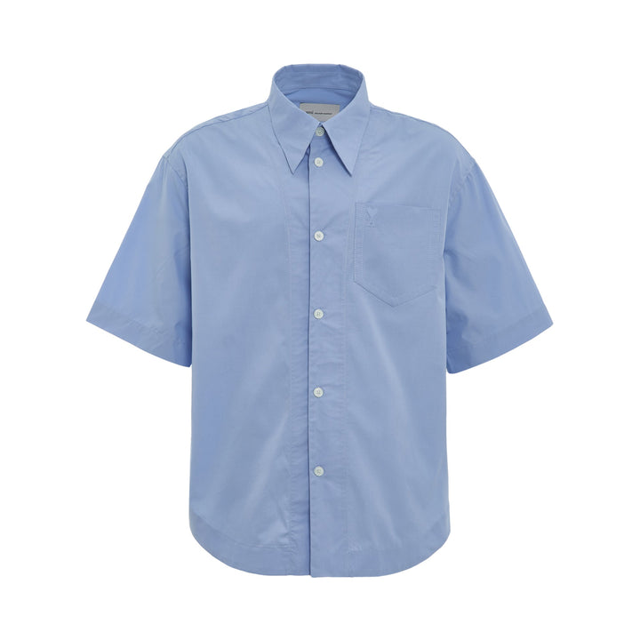 AMI Wide Patch Pocket Shirt in light blue with short sleeves, point collar, front button placket, and chest patch pocket