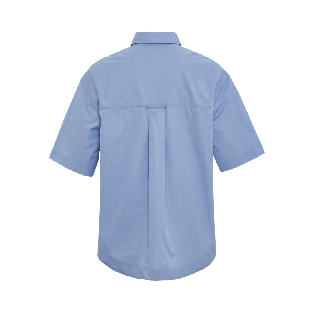 AMI Wide Patch Pocket Shirt in light blue with short sleeves, point collar, front button placket, and chest patch pocket