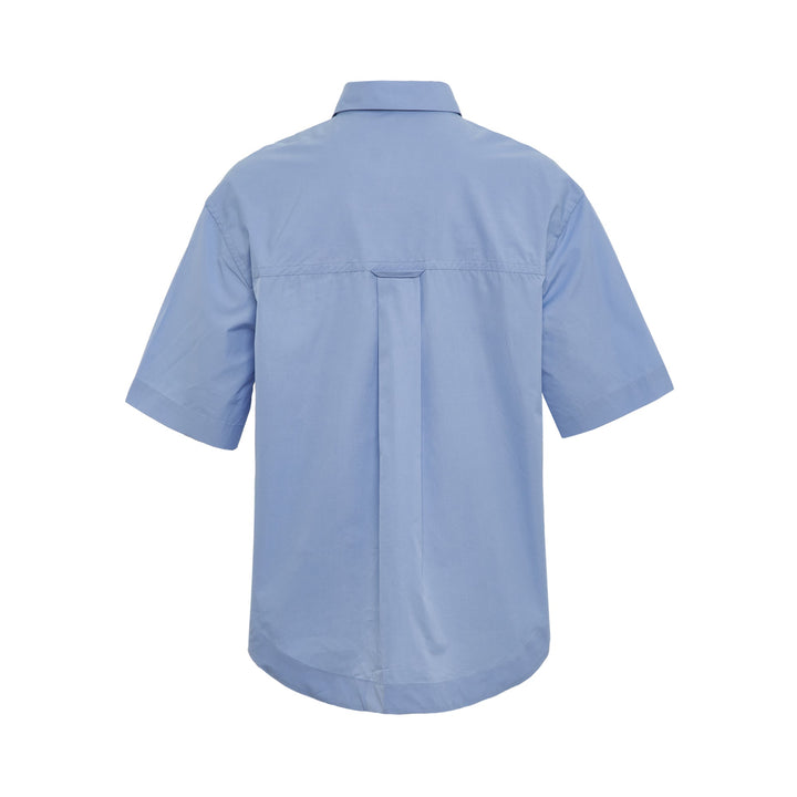 AMI Wide Patch Pocket Shirt in light blue with short sleeves, point collar, front button placket, and chest patch pocket