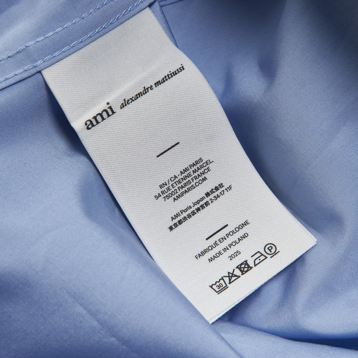 AMI Wide Patch Pocket Shirt in light blue with short sleeves, point collar, front button placket, and chest patch pocket