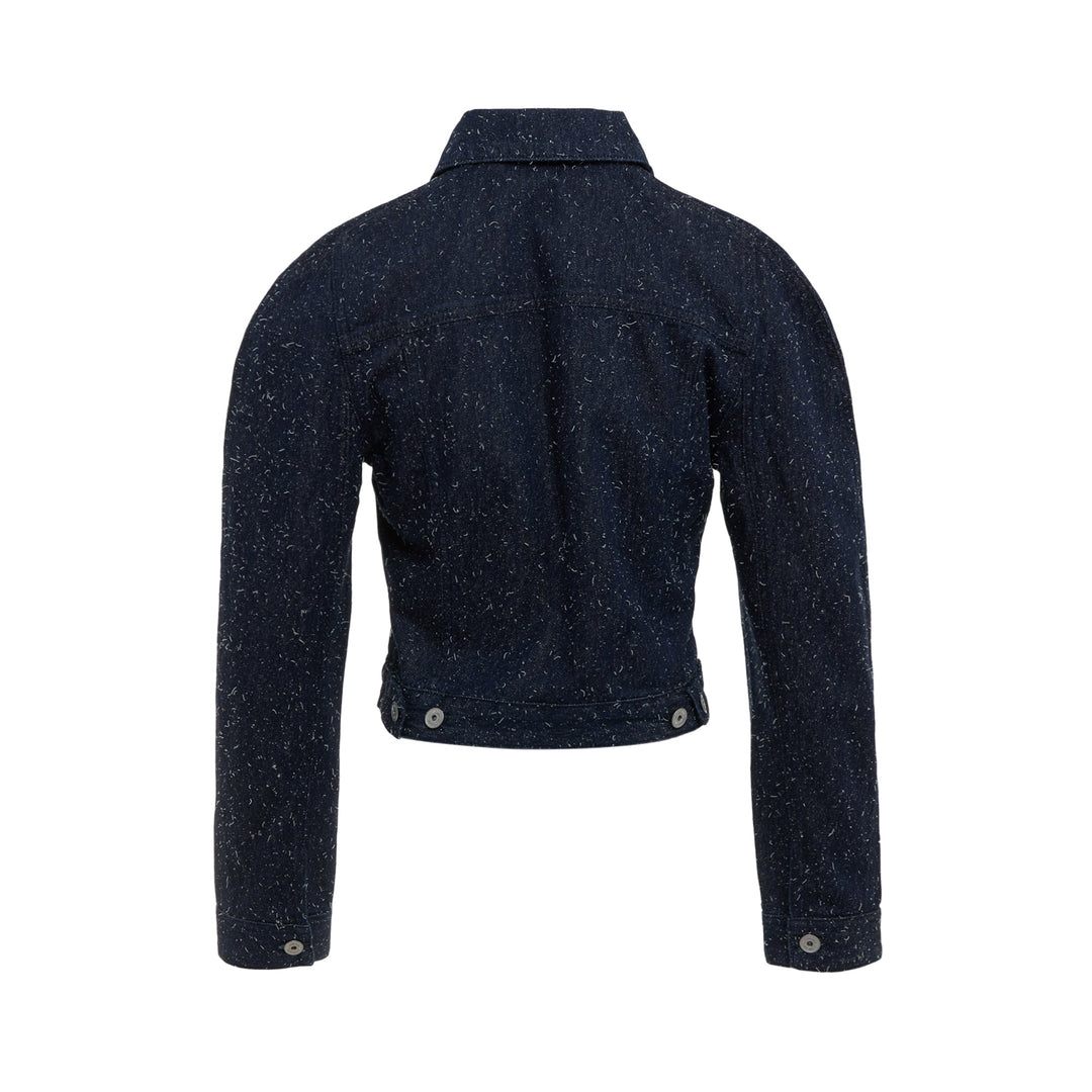 Jacquemus dark indigo speckled denim cropped jacket with point collar, chest flap pockets, and button-front closure