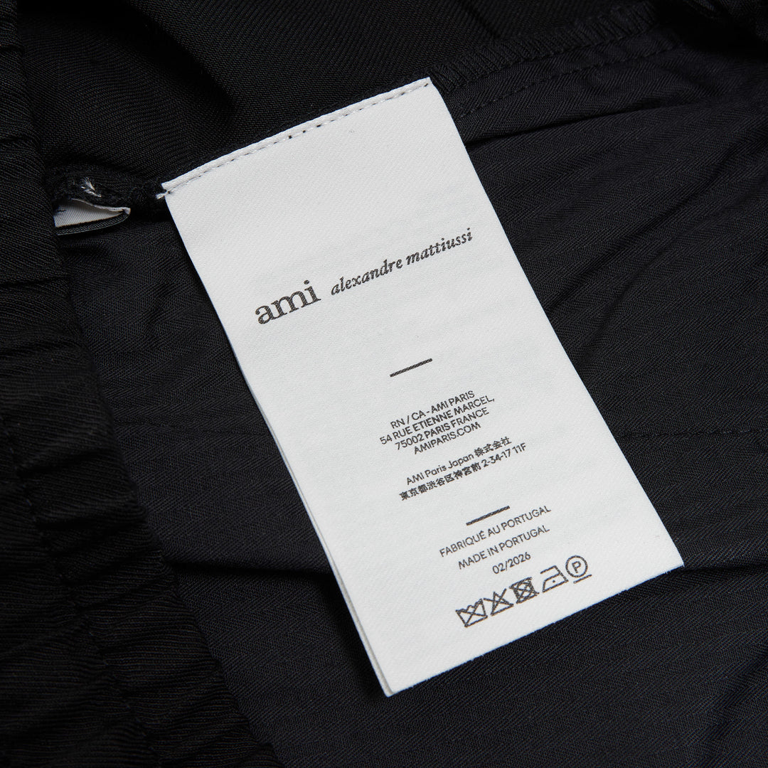 AMI Elasticated Waist Wide Leg Trousers in black with smocked waistband and drawstring tie