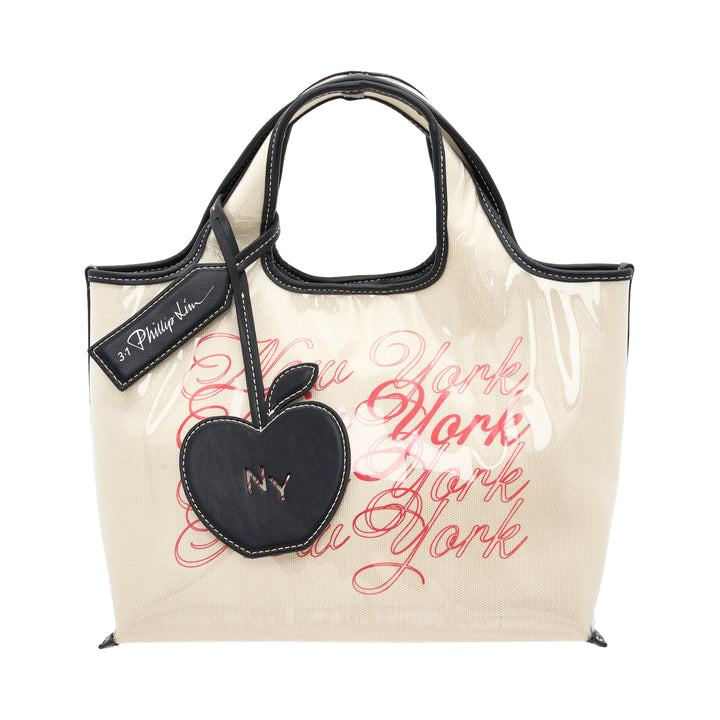 3.1 Phillip Lim We Are NY Mini Market Tote in natural canvas with red cursive New York script print, black leather handles, contrast stitching, and a detachable black leather Big Apple charm engraved with NY